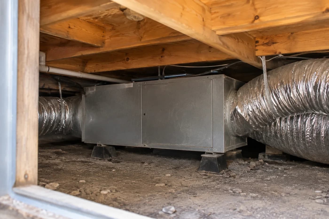 Ducted heating unit and insulated ducting beneath a timber floor